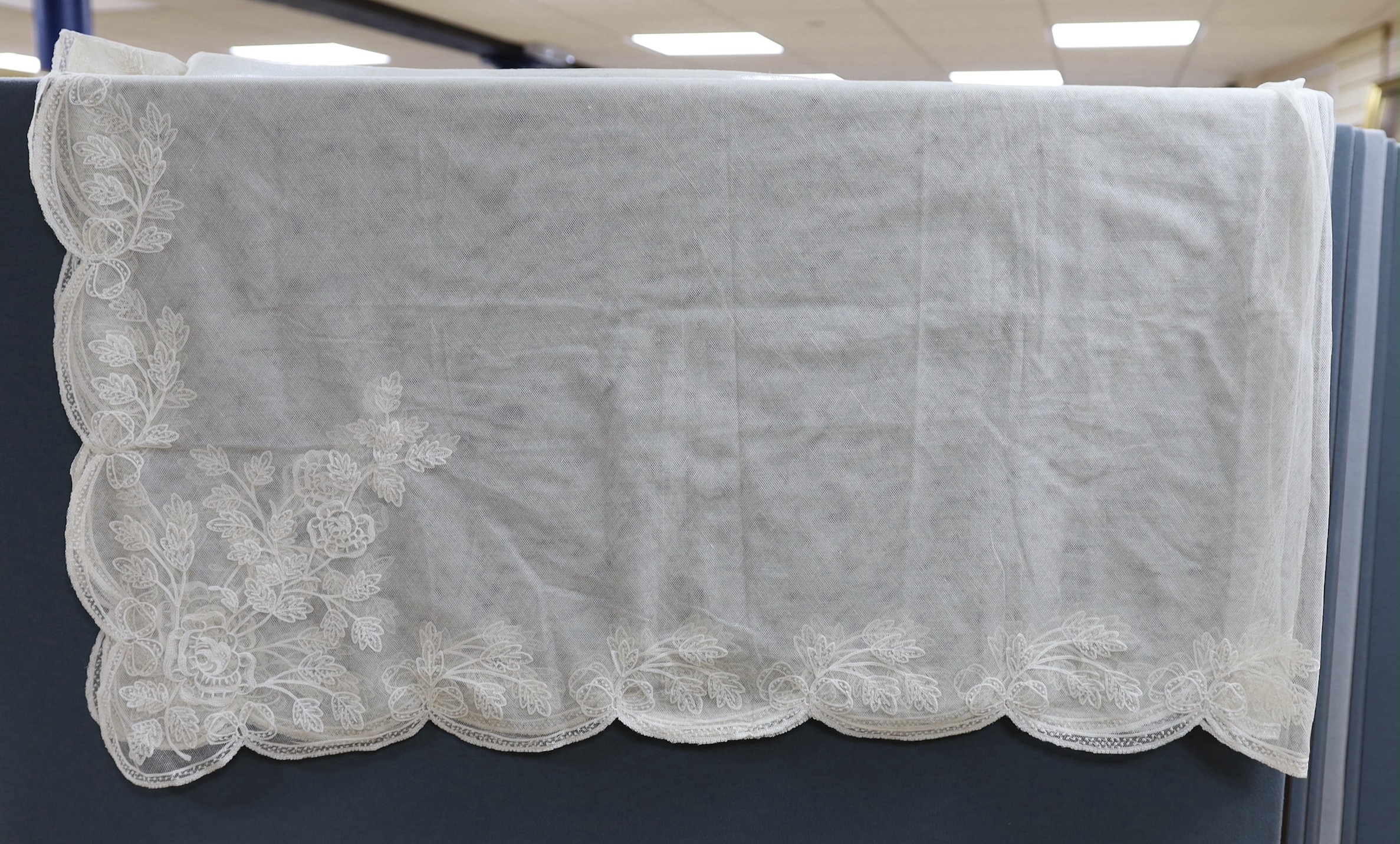 An early 20th century machine lace wedding veil, 120 cms x 186 cms